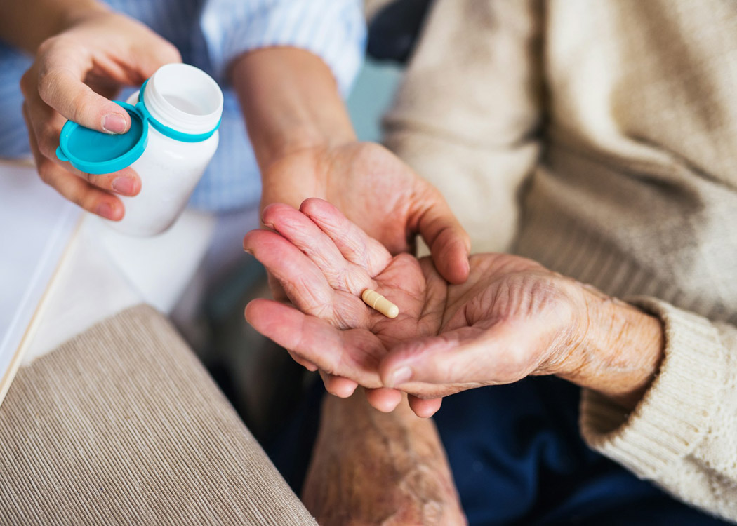 caregiver providing medication